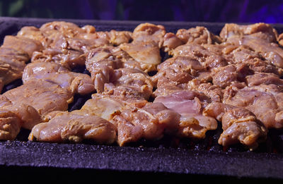 Close-up of meat on barbecue grill