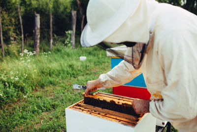 Low angle view of man working on cutting board