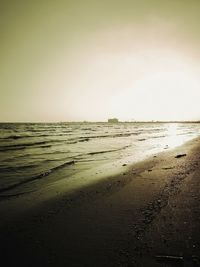 Scenic view of beach against clear sky