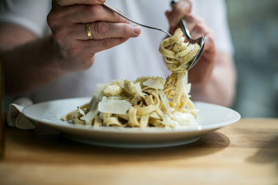 Midsection of person preparing food