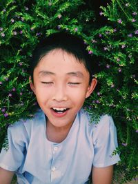 Portrait of smiling boy on plants
