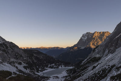 Scenic view of mountains against sky during winter