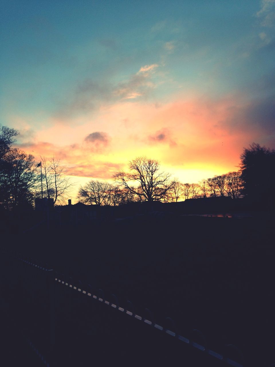 sunset, silhouette, sky, orange color, tree, beauty in nature, scenics, tranquility, cloud - sky, tranquil scene, nature, landscape, dramatic sky, idyllic, cloud, dark, built structure, dusk, bare tree, outdoors