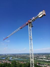 Crane against clear blue sky