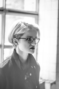 Close up woman with glasses in office monochrome portrait picture