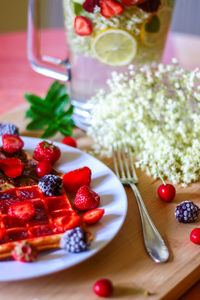 Close-up of fruits in plate on table