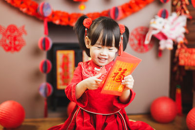 Cute girl standing in traditional clothing