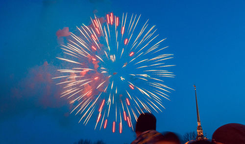 Low angle view of firework display at night