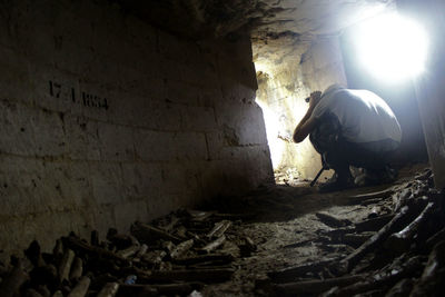 Man standing in abandoned building