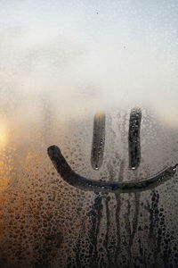 Close-up of wet window during winter