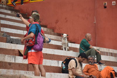 Rear view of people on staircase