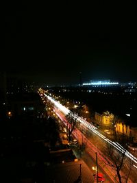 High angle view of light trails on road at night