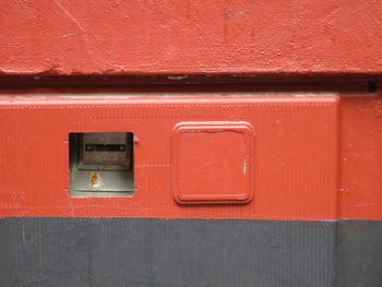 Red wall with electricity meter