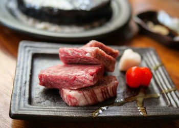 Close-up of meat on cutting board