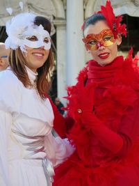 Women wearing masks and costumes during carnival