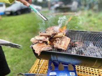 Cropped hand of person preparing food