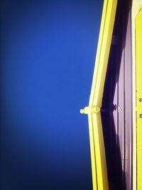 Low angle view of built structure against clear blue sky