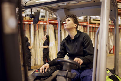 Female forklift operator working in lumber industry