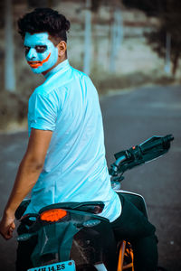 Midsection of man riding motorcycle