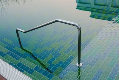 High angle view of metallic floor by swimming pool