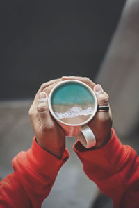 Close-up of hand holding drink