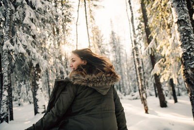 Woman in forest during winter