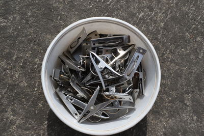 High angle view of clothespins in container