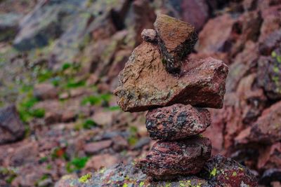 Close-up of rusty stack on rock