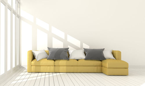Empty sofa against wall at home
