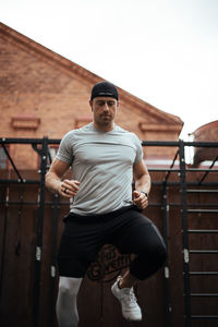 Mature man exercising in backyard