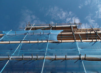 Low angle view of built structure against blue sky