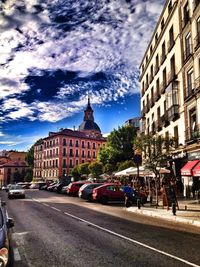 City street against cloudy sky