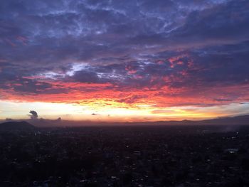 Scenic view of dramatic sky at sunset