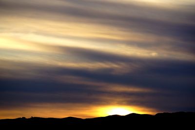 Low angle view of dramatic sky during sunset