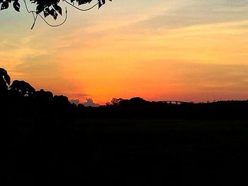 Silhouette of landscape against dramatic sky