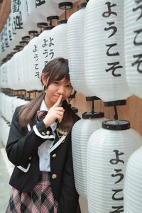 Portrait of a smiling young woman with text