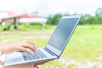 Man using laptop outdoors