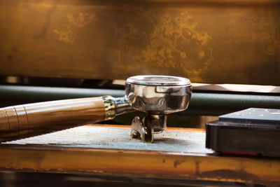 Close-up of old tea light on table