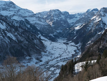 Scenic view of snowcapped mountains against sky