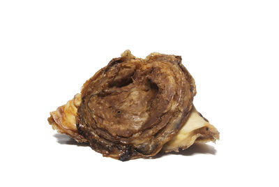 Close-up of burger against white background