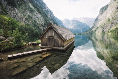 Calm lake with mountains in background