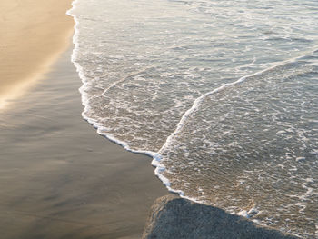 High angle view of surf on beach