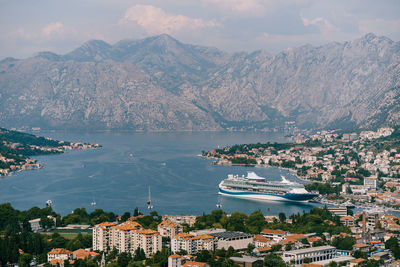 High angle view of townscape and mountains against sky