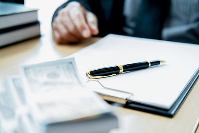 Close-up of a pen on table