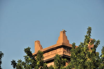 Low angle view of building against blue sky