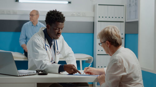 Doctor examining patient at hospital