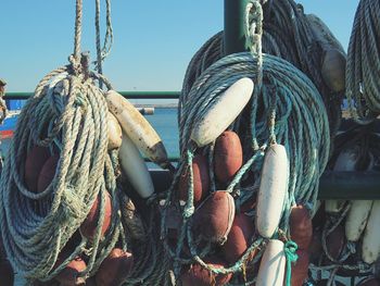 Close-up of fishing net hanging on rope