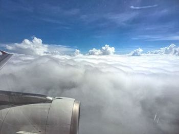 Aerial view of landscape against cloudy sky