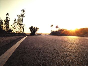 Empty road at sunset