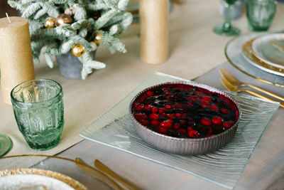 Homemade christmas or new year holiday berry pie on the background of the festive table.